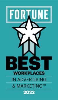 Teal background with a white star and ribbon design. Text reads: "Fortune Best Workplaces in Advertising & Marketing 2022.