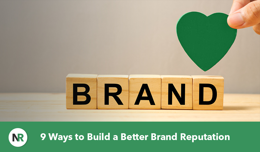 Wooden blocks spell "BRAND" with a hand placing a green heart next to them. The text at the bottom reads, "9 Ways to Build a Better Brand Reputation" on a green strip with a circular logo to the left. This visual emphasizes essential steps to build a better brand reputation effectively.