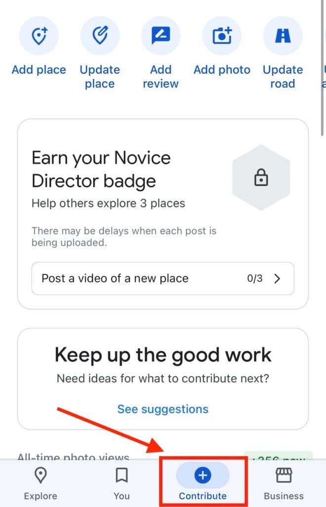 Screenshot of a mobile app interface showing options to add or update content, with a highlighted “Contribute” button. It encourages earning a Novice Director badge by exploring places and posting videos, along with a motivational message.