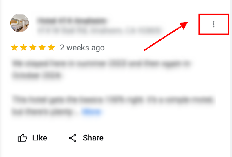 A blurred online review of a hotel with a five-star rating and a comment from 2 weeks ago. Icons for Like and Share are visible at the bottom. A red arrow points to a menu icon with three vertical dots.